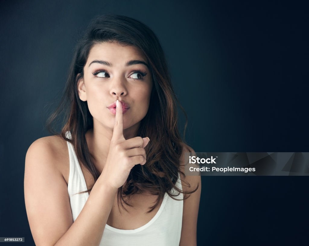 Im Not Saying A Word Stock Photo Download Image Now Finger On Lips Whispering Women IStock